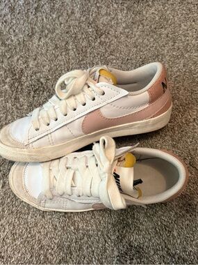 Nike White Sneakers with Blush Pink Swoosh and Yellow Tongue Tab